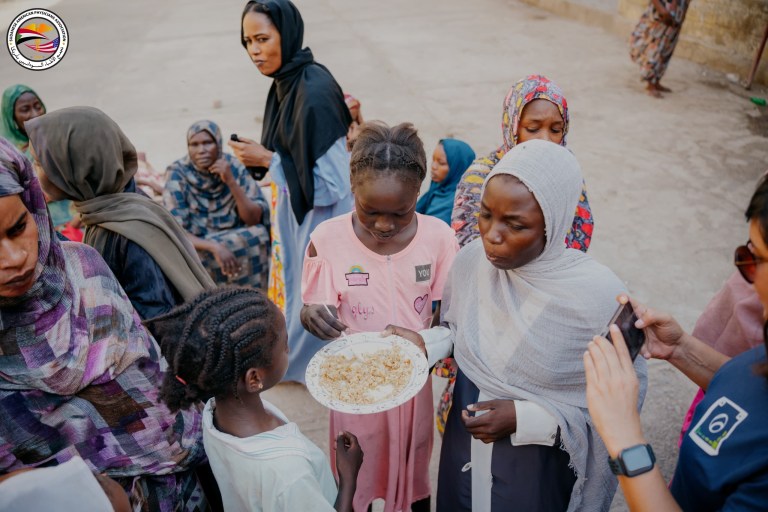Sudanese women sharing food during Hunger Crisis Sudan